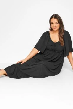 LIMITED COLLECTION Curve Black Ruched Angel Sleeve Dress -Luna Looks Zone 67b5a4e6 96f1 44 214535 D