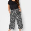 YOURS Curve Black Floral Print Cropped Trousers